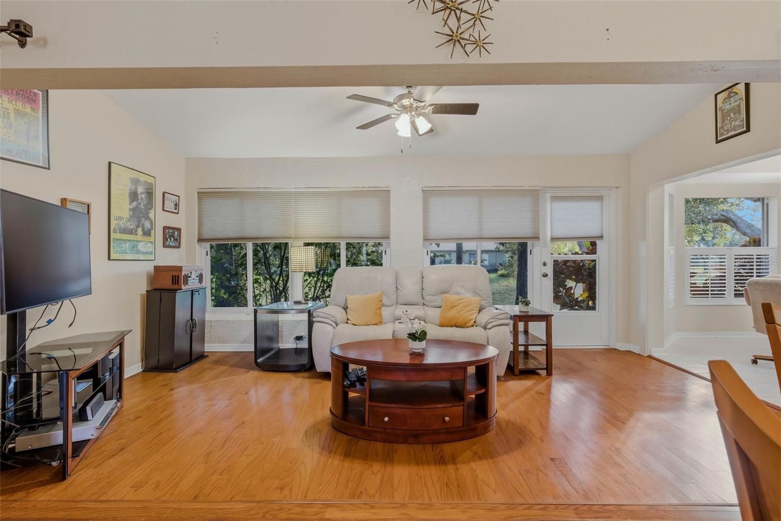 Beautiful hardwood floors flow from the entryway all the way to the den.