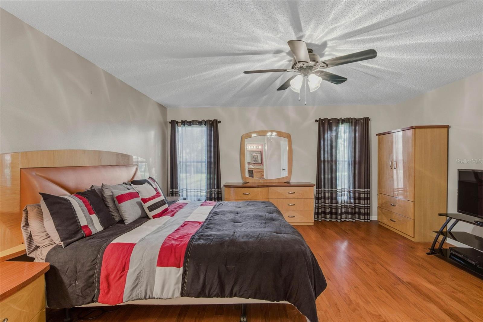 Dual windows illuminate the spacious primary suite