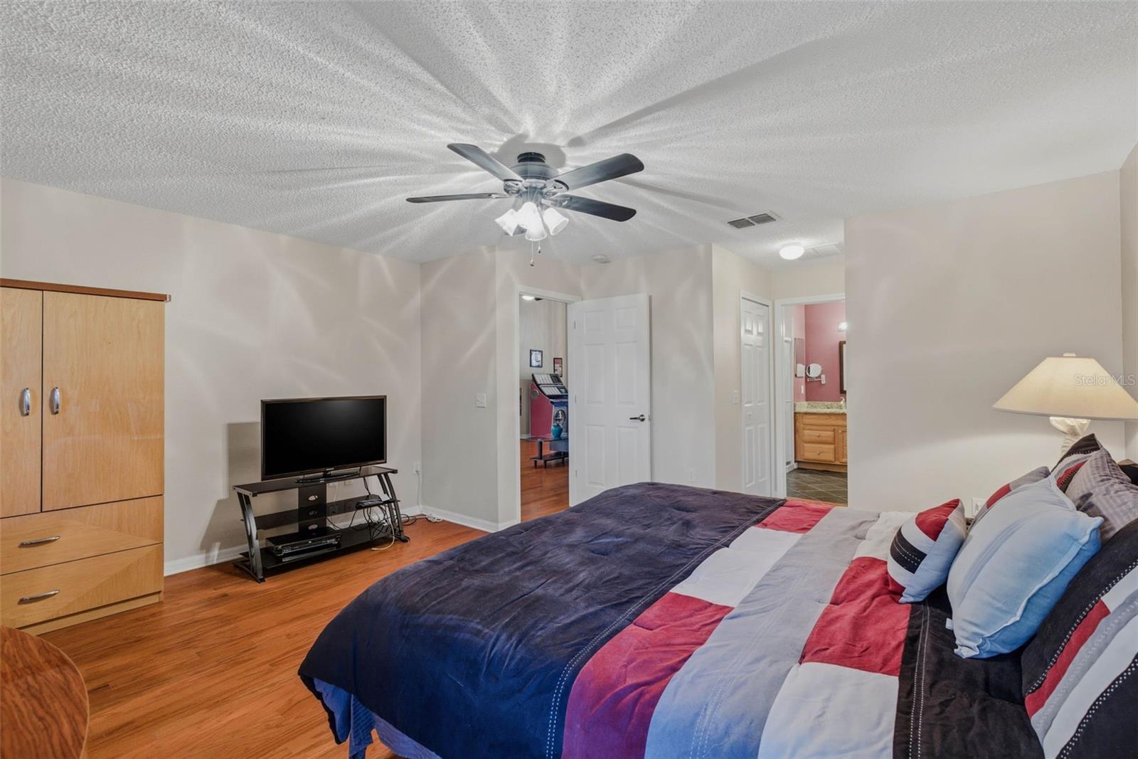 View emphasizes the spacious primary bedroom with two walk-in closets designed for comfort and practicality.