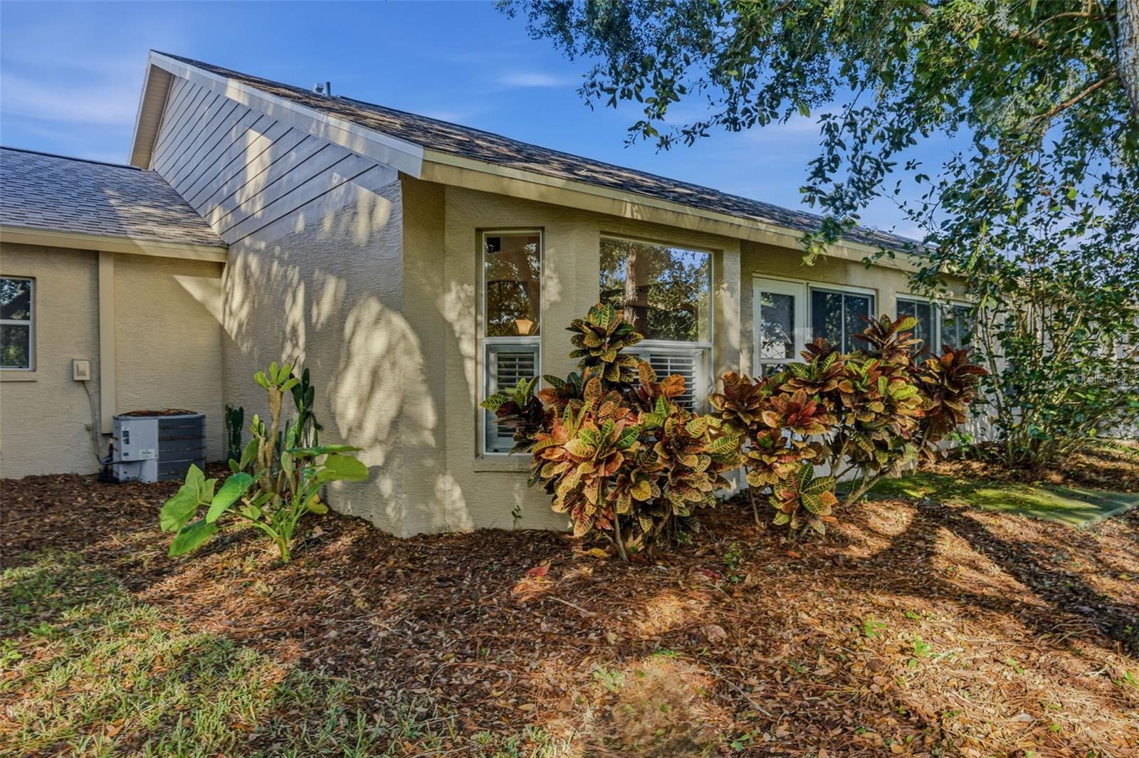 Shrubs accent the exterior