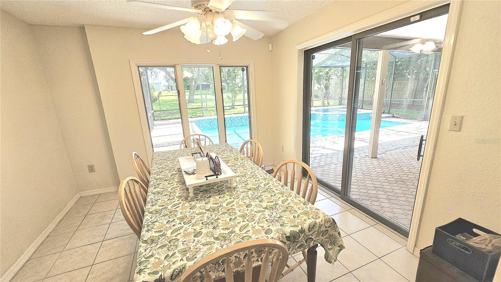 Private dining room with a view of your pool and lots of green space.