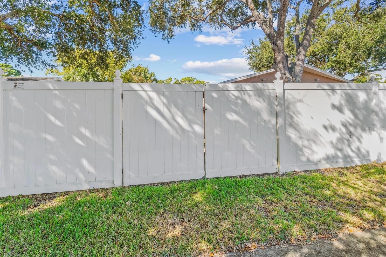 double gate on side street to back yard