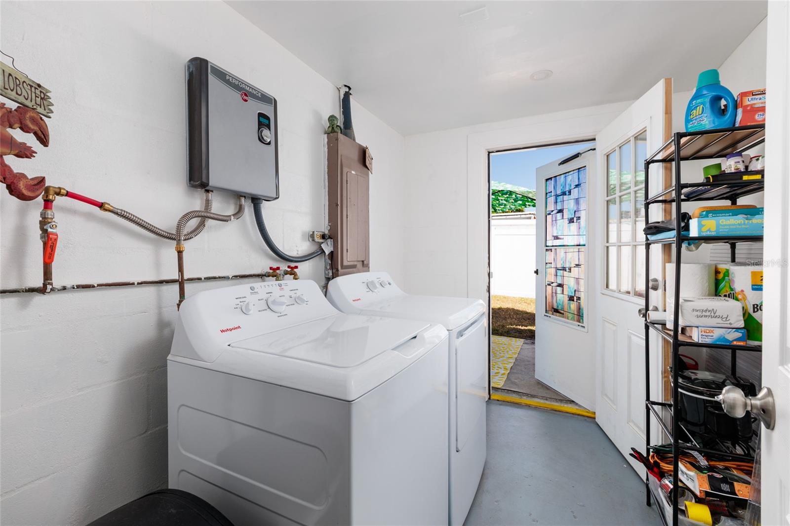 Laundry room w/door to back yard.