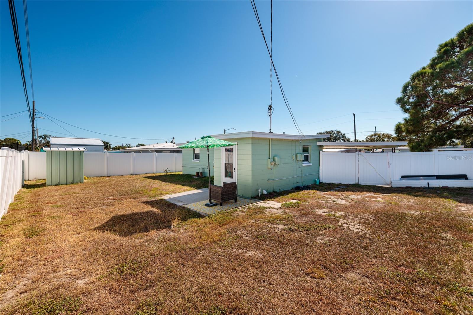 Large back yard, patio & shed.