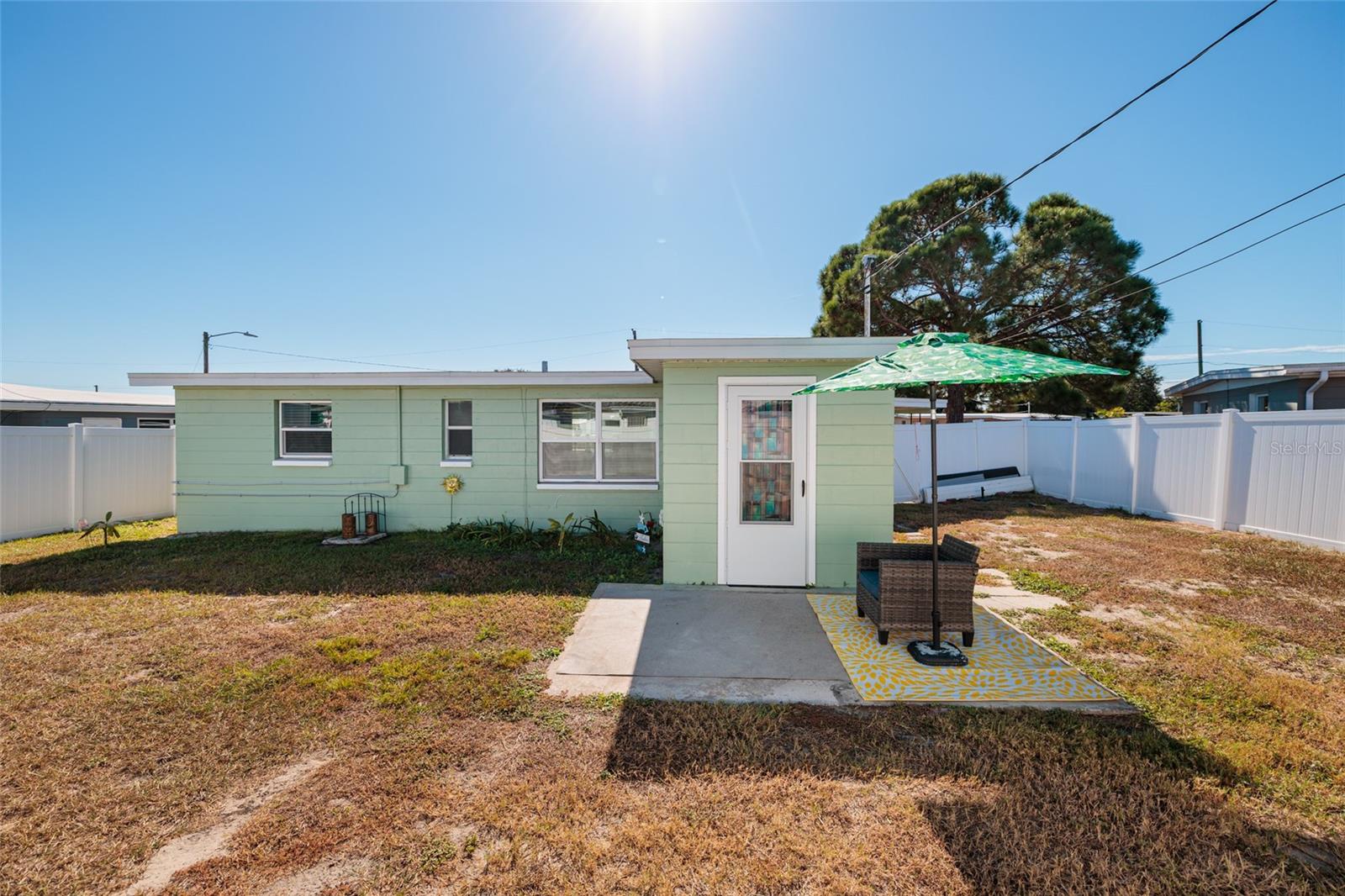 Back yard, patio. All windows have hurricane panels.