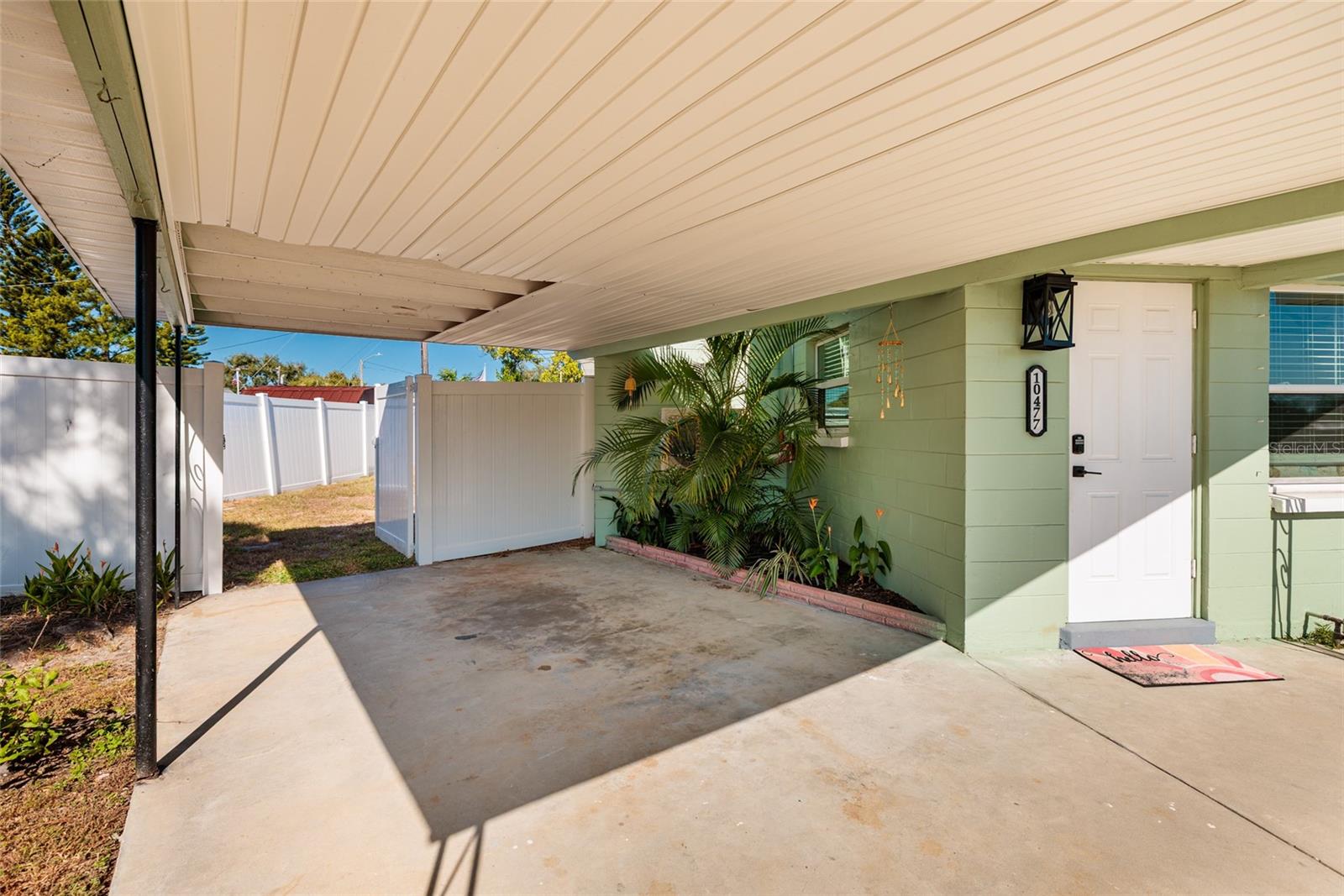 Carport & gate to back yard.