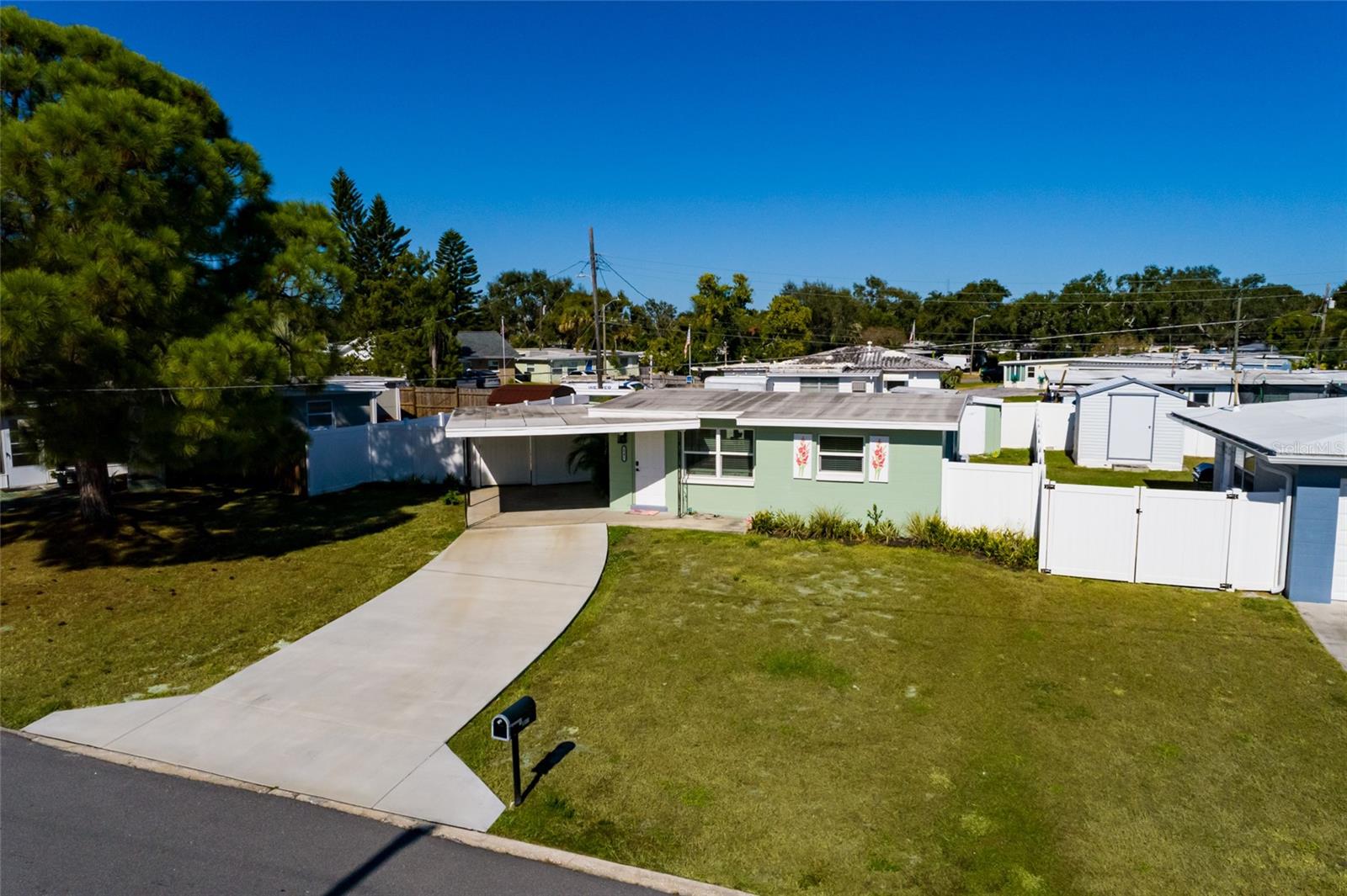 New driveway & solid block house.