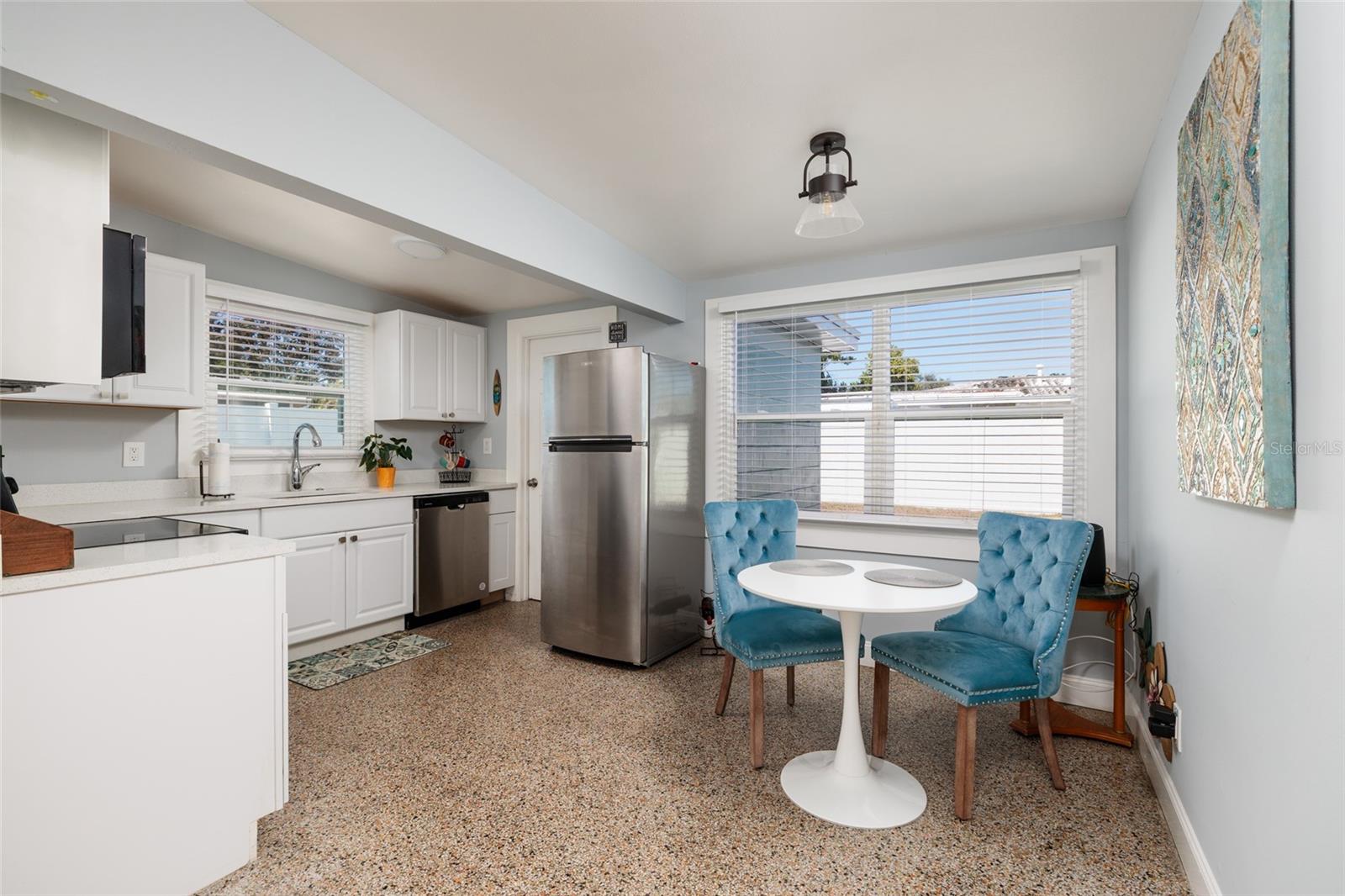 Kitchen & dining room. Vaulted ceiling. Double pane windows.