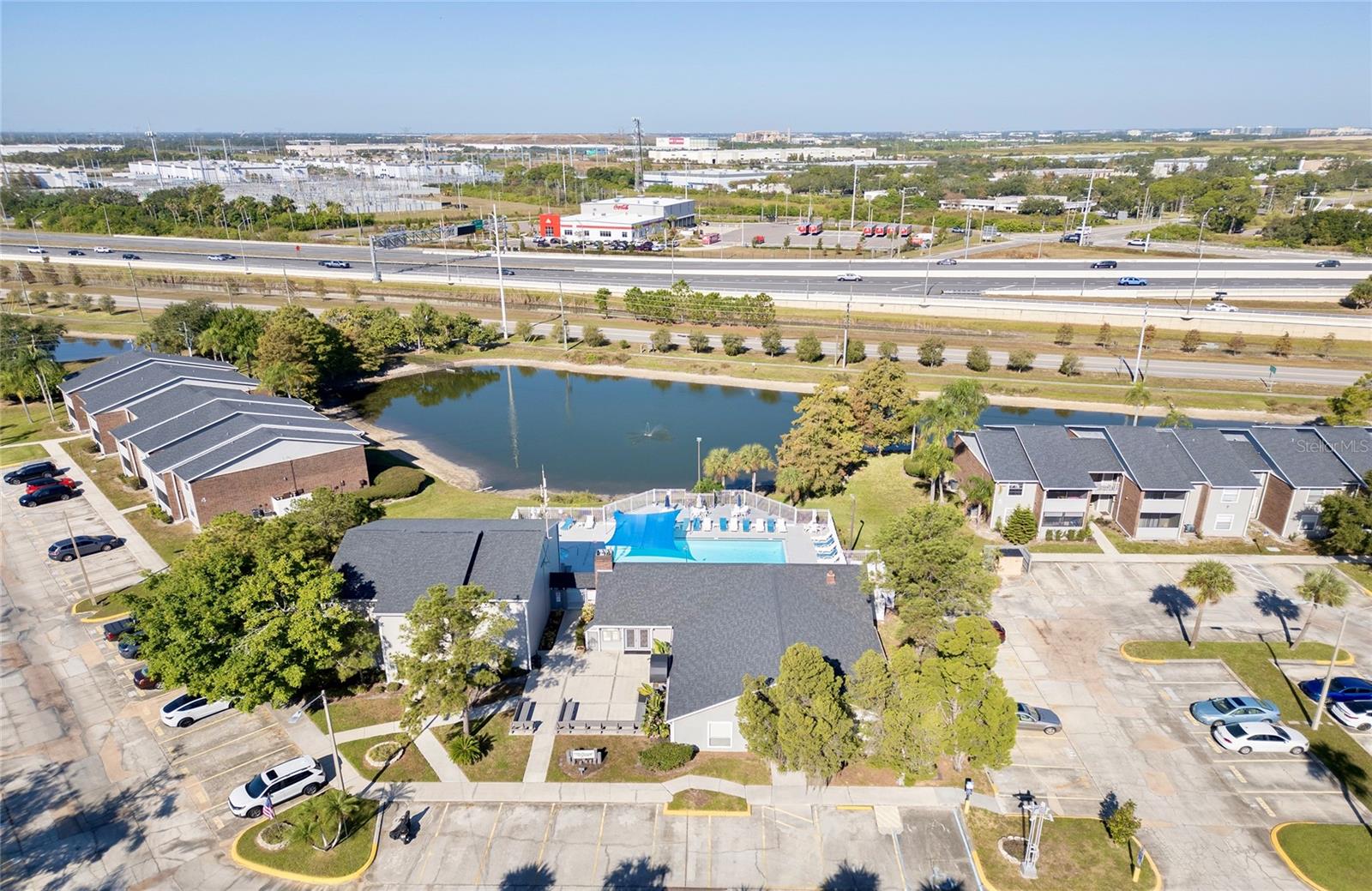 Community pool and clubhouse next to the pond