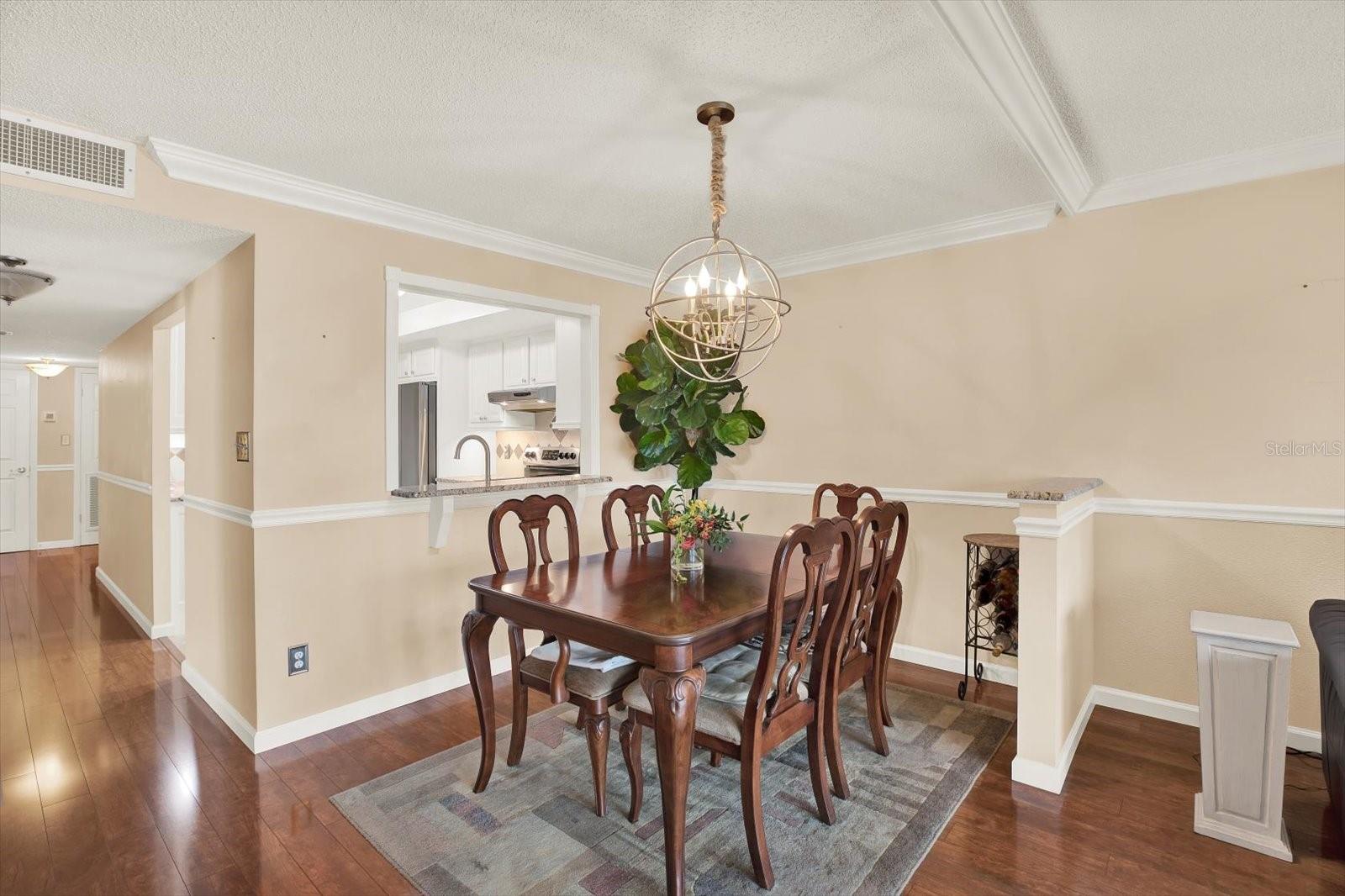 Chair rail and crown moulding elevate this unit with classic character and timeless appeal and value.