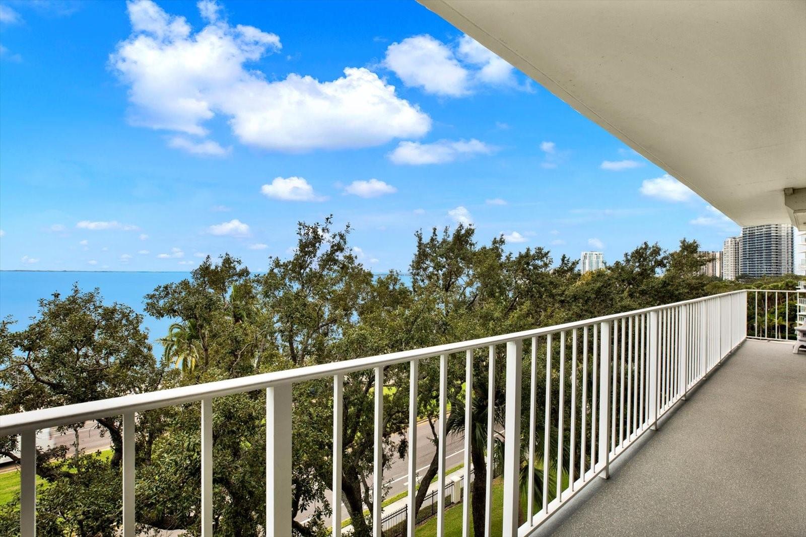 The balcony wraps around unit 501 continuously.