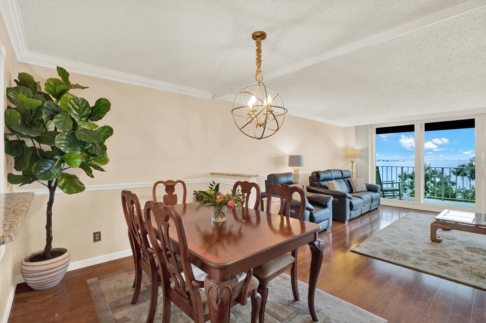 Open concept living space with a view of the water from the living room.