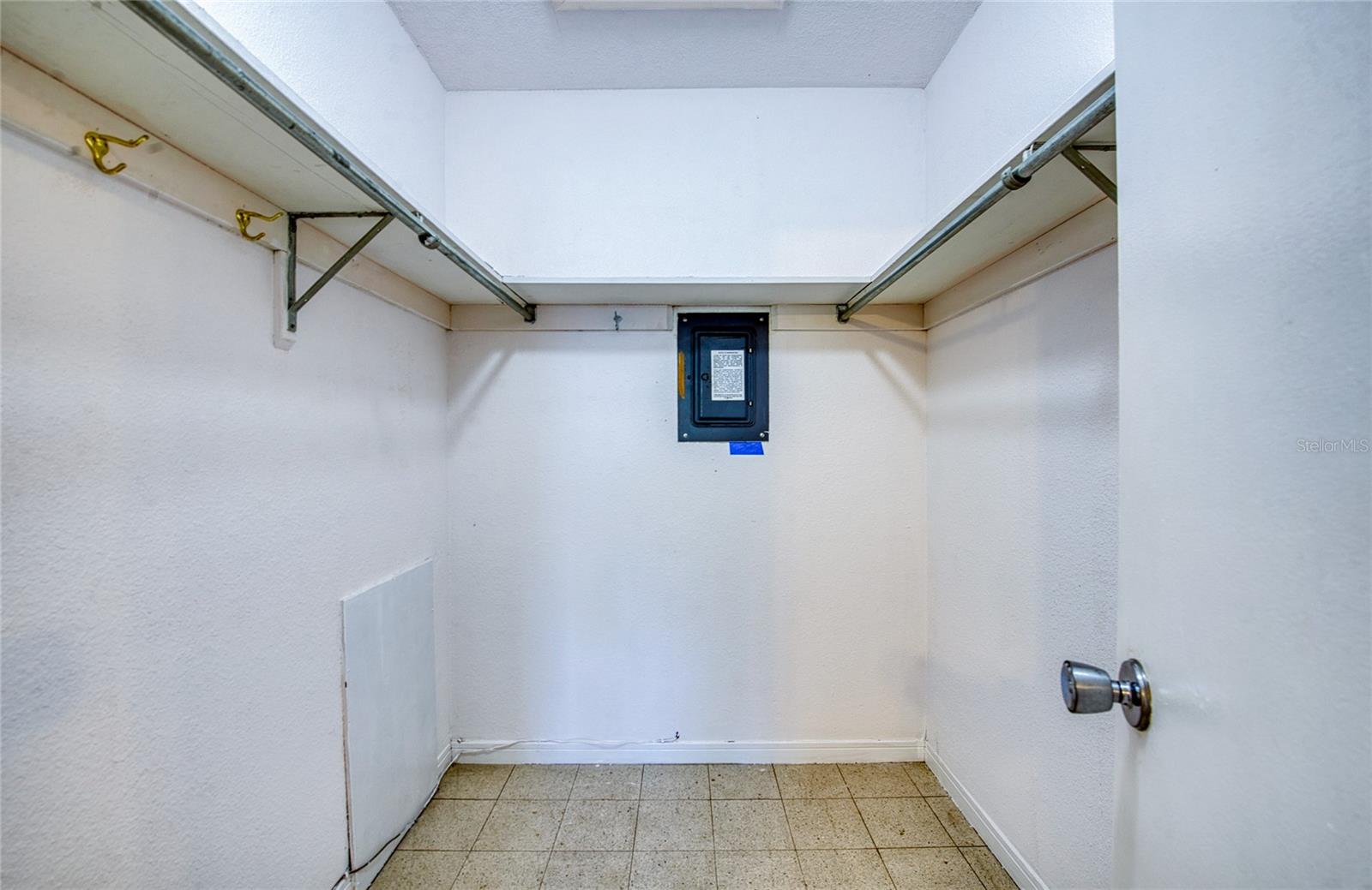 Primary bedroom walk-in closet