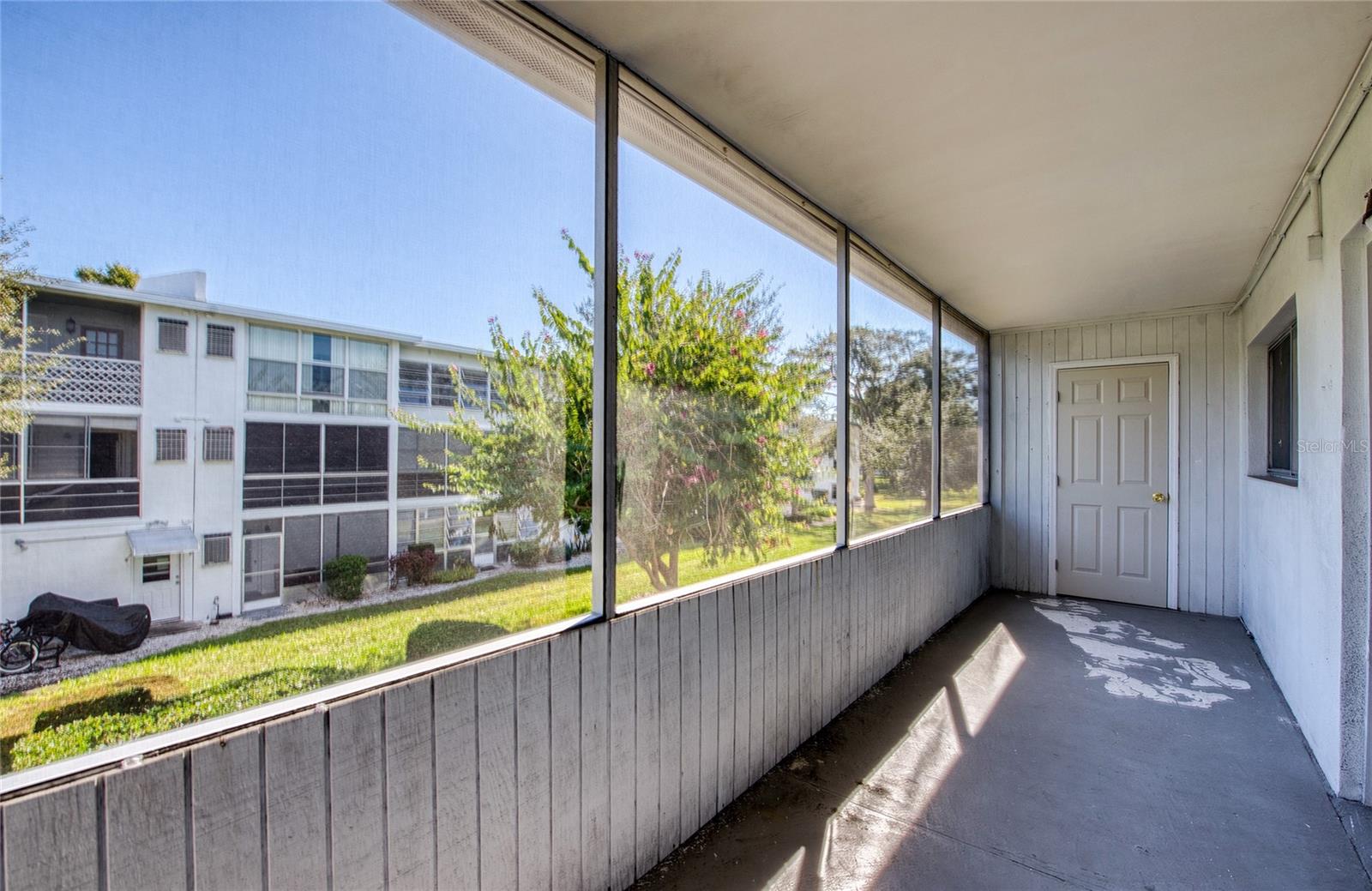Screened-in porch with storage closet off of the bedroom