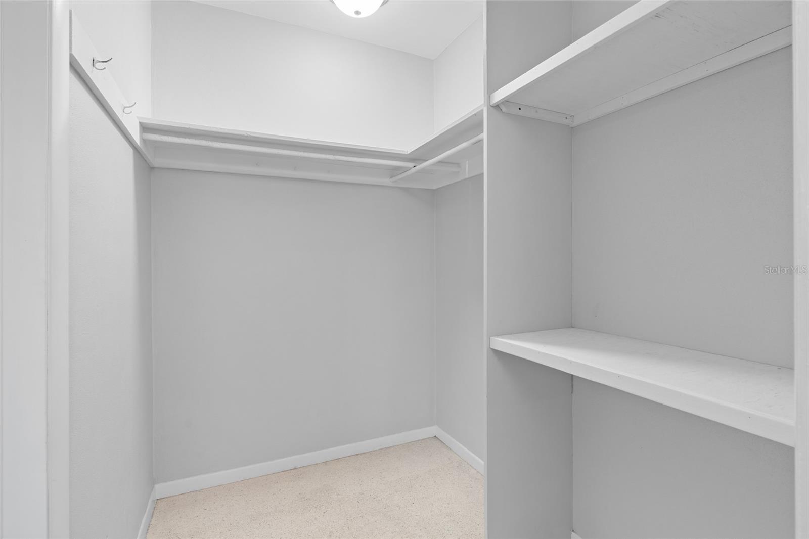 Primary bedroom with walk in closet and bathroom