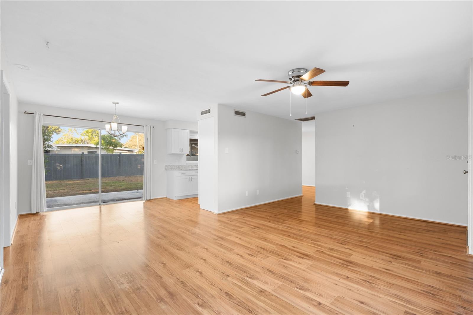 Open floor plan leads from living room, to dining area and into the kitchen