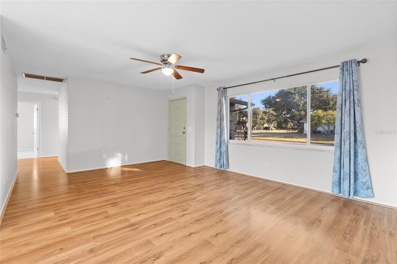 Open floor plan leads from living room, to dining area and into the kitchen
