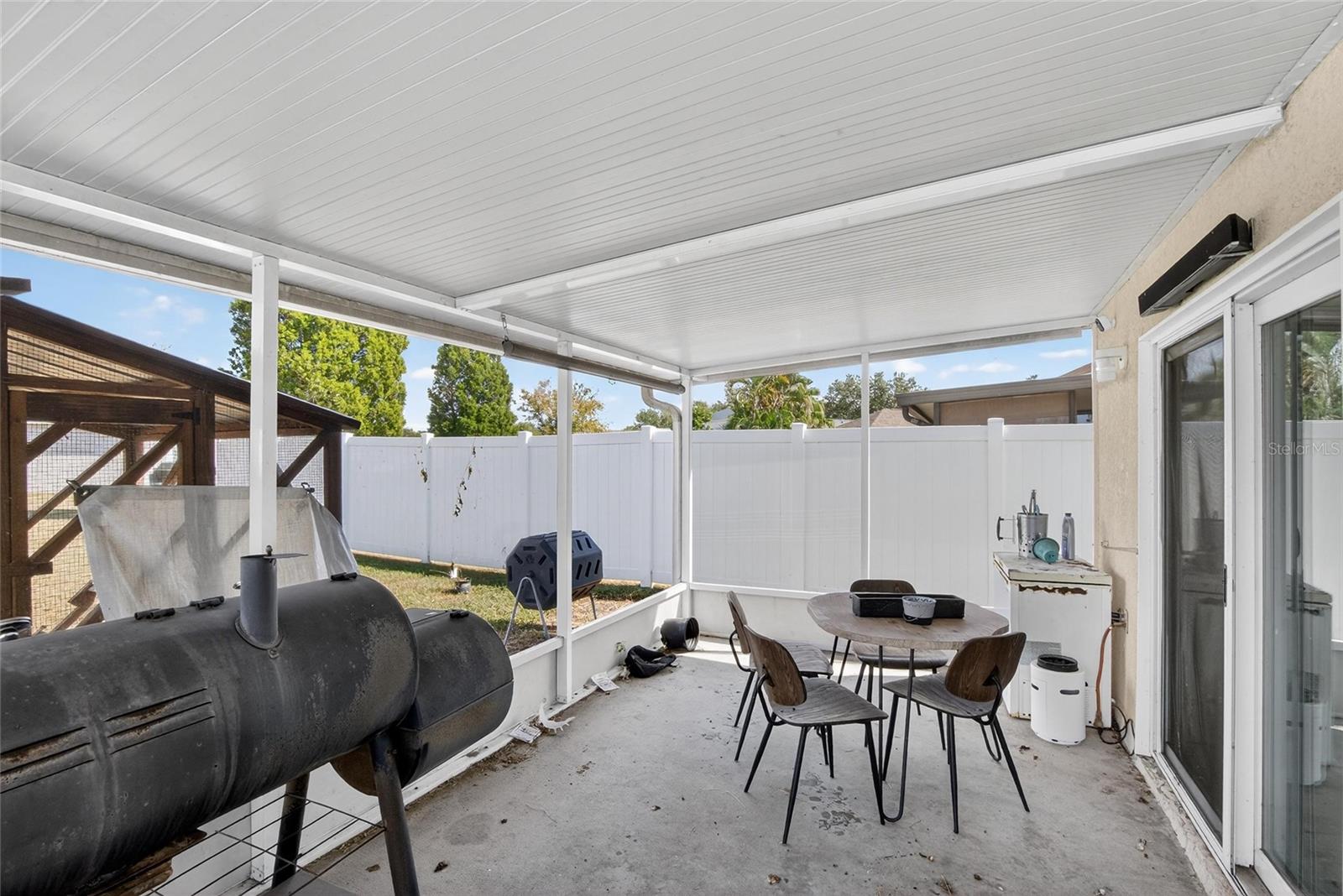 Screened Patio.  Sliders to the kitchen to the right.