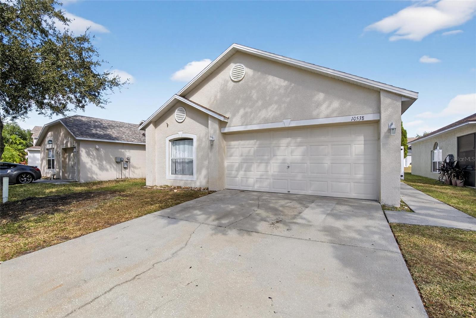 Front of house.  Walkway to entry door to the right.