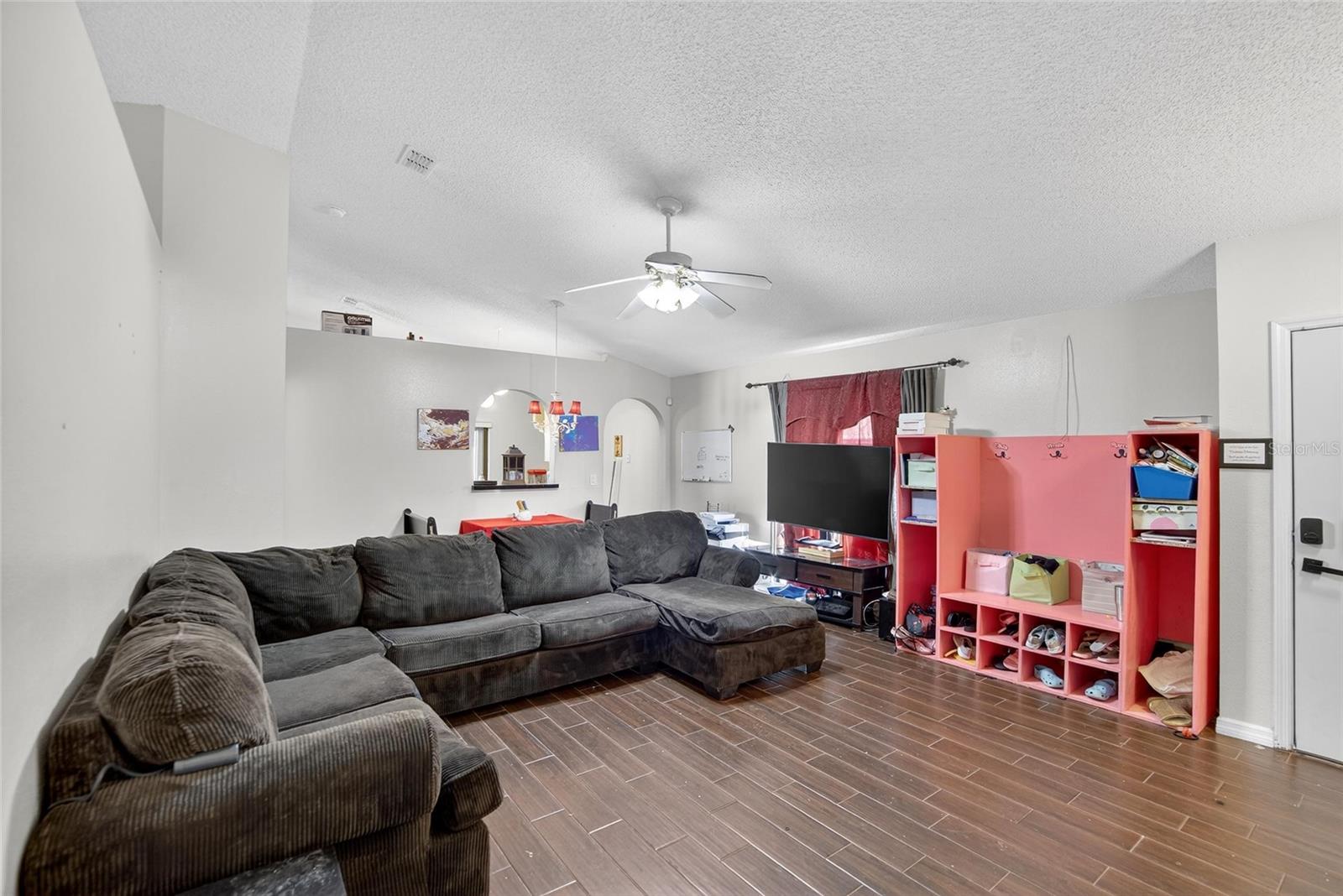 Family Room Dining Area combo.  Kitchen entry to the back right.  Entry door to far right.