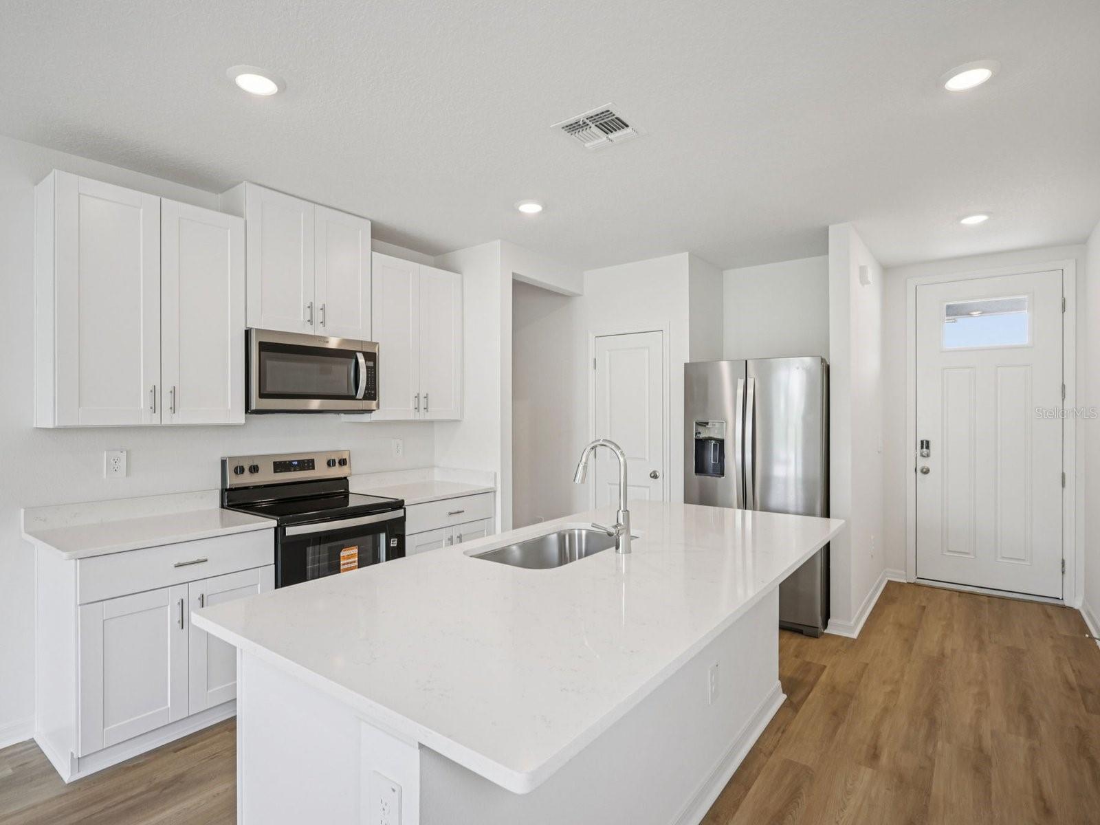 Photos are not of the actual home, but are photos of the builder home with same floorplan with similar interior finishes.