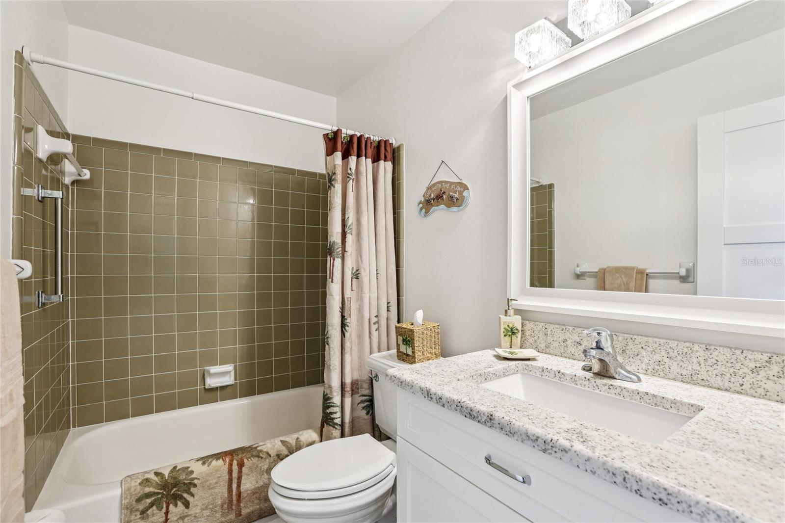 The main bathroom is conveniently located just outside the second bedroom for easy access.