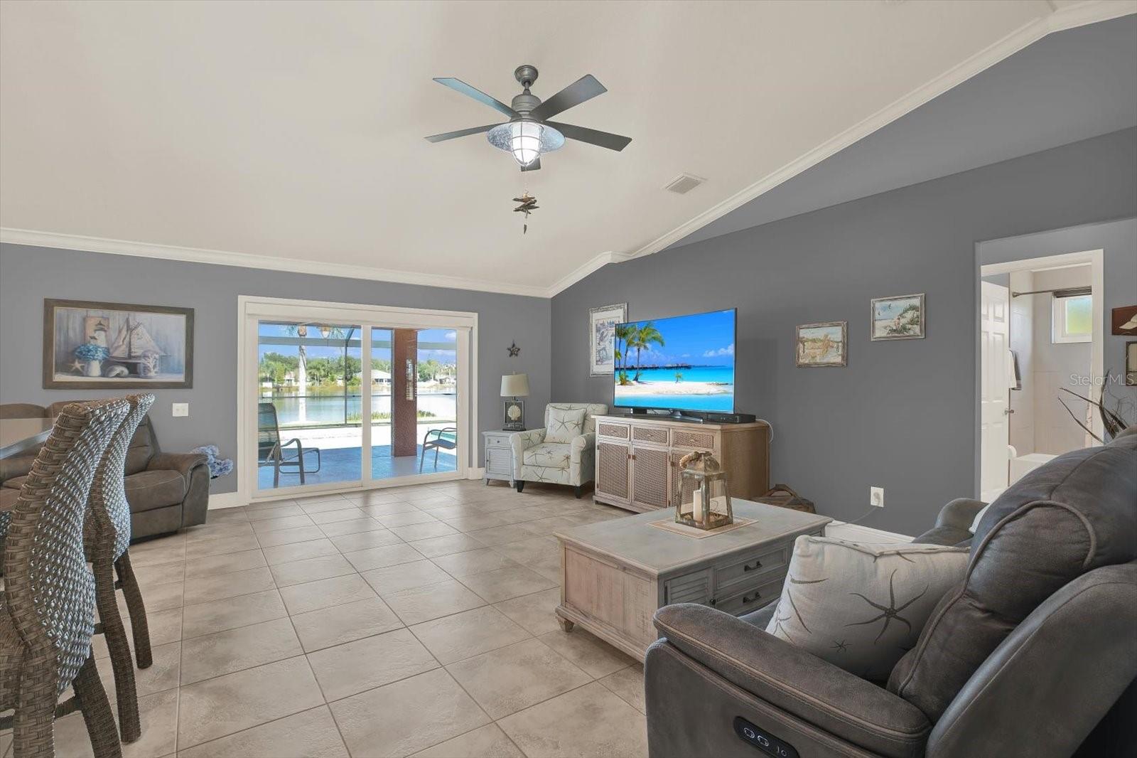 From the moment you enter, you immediately notice the great room's easy flow from indoor to outdoor living that is perfect for the Florida lifestyle.