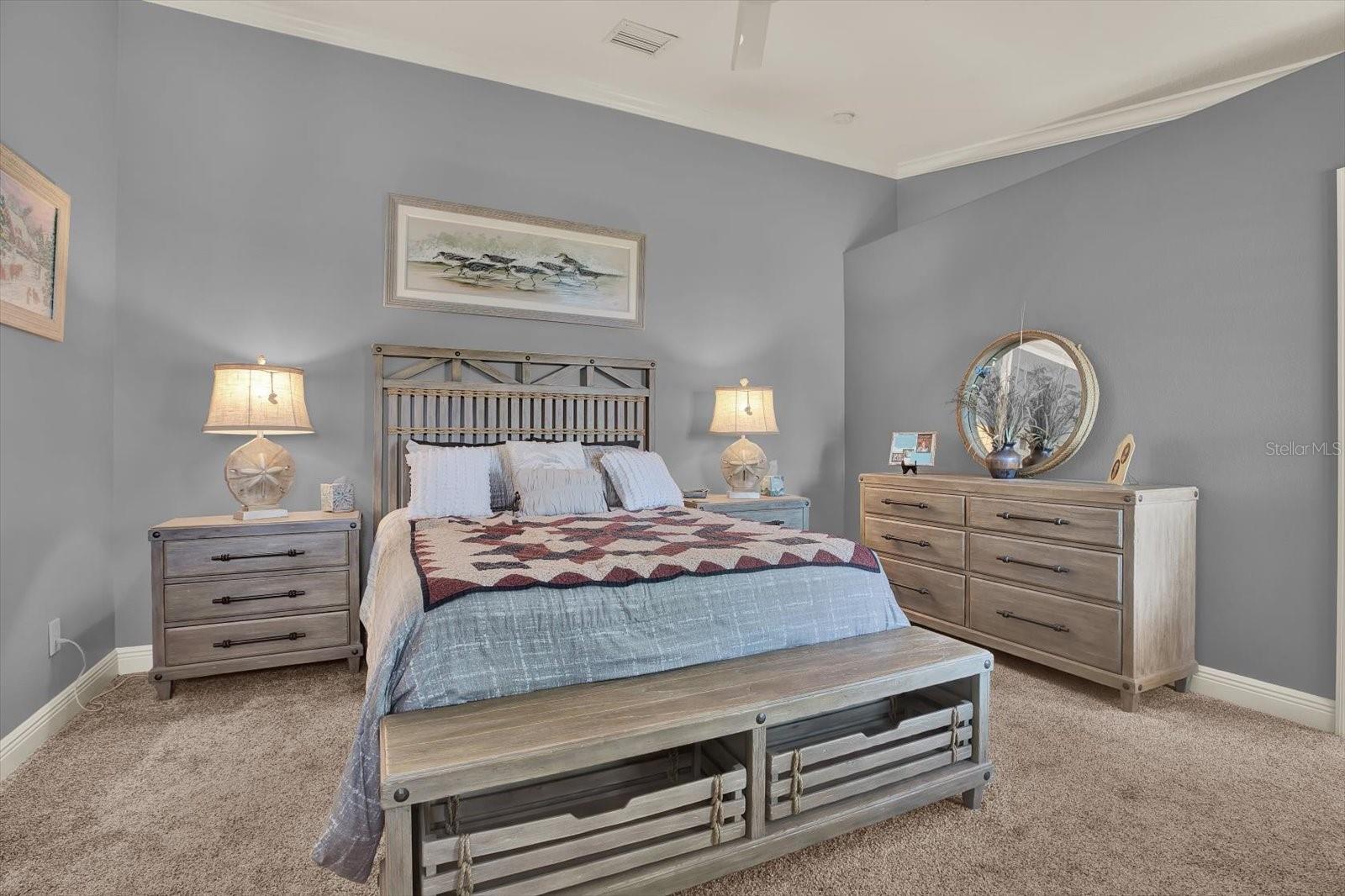 The primary suite boasts room for an extensive suite of furniture.