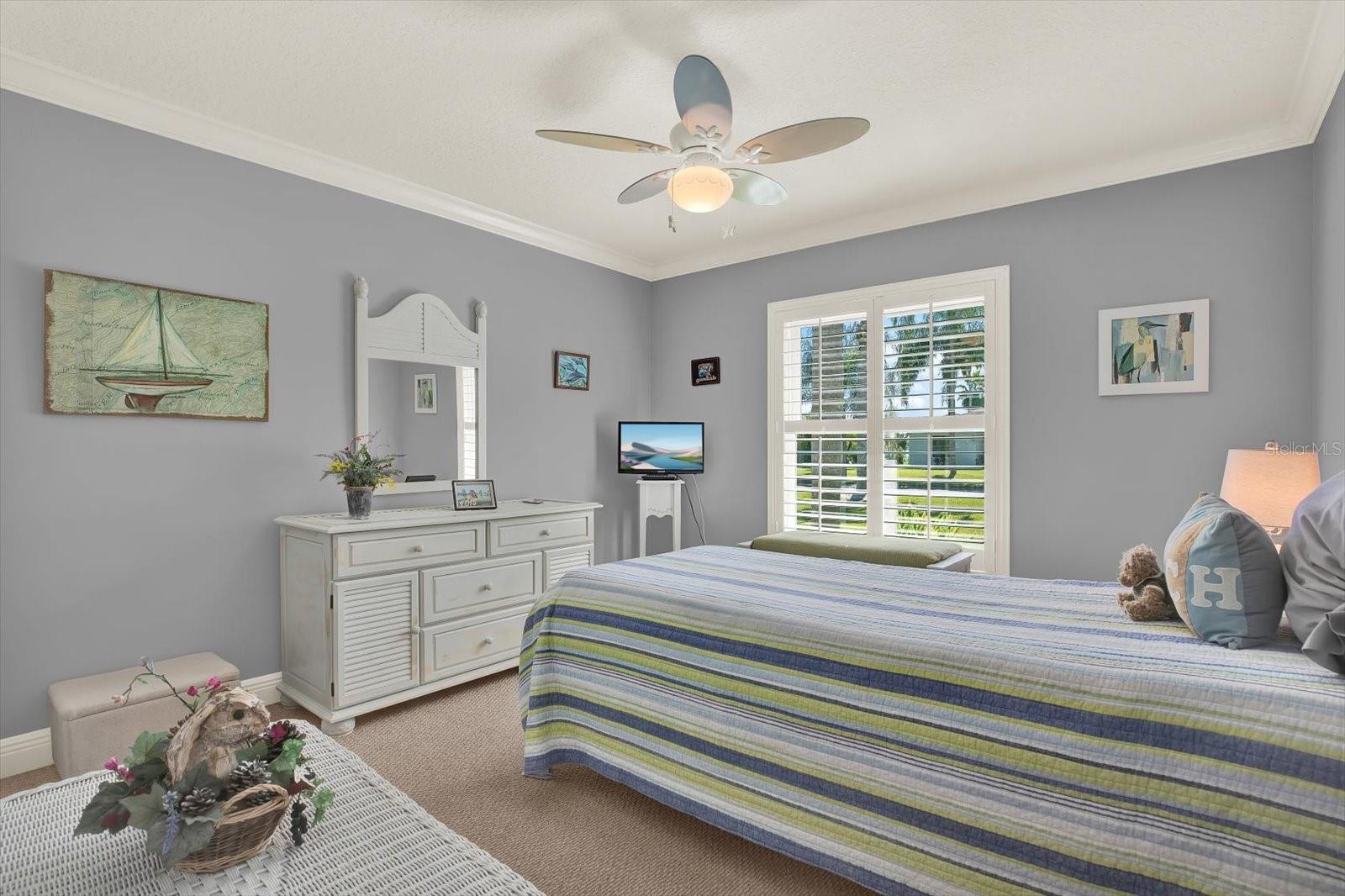 The sunny third bedroom overlooks the well manicured front lawn.