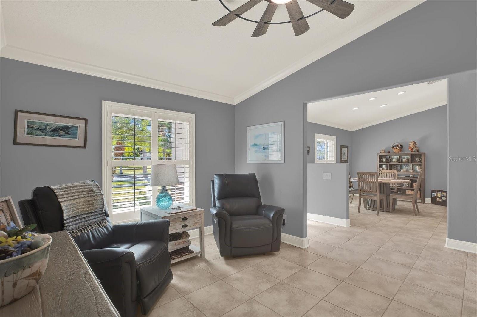 Once inside the front door, you are greeted by the high ceilings in the den and dining room on either side.