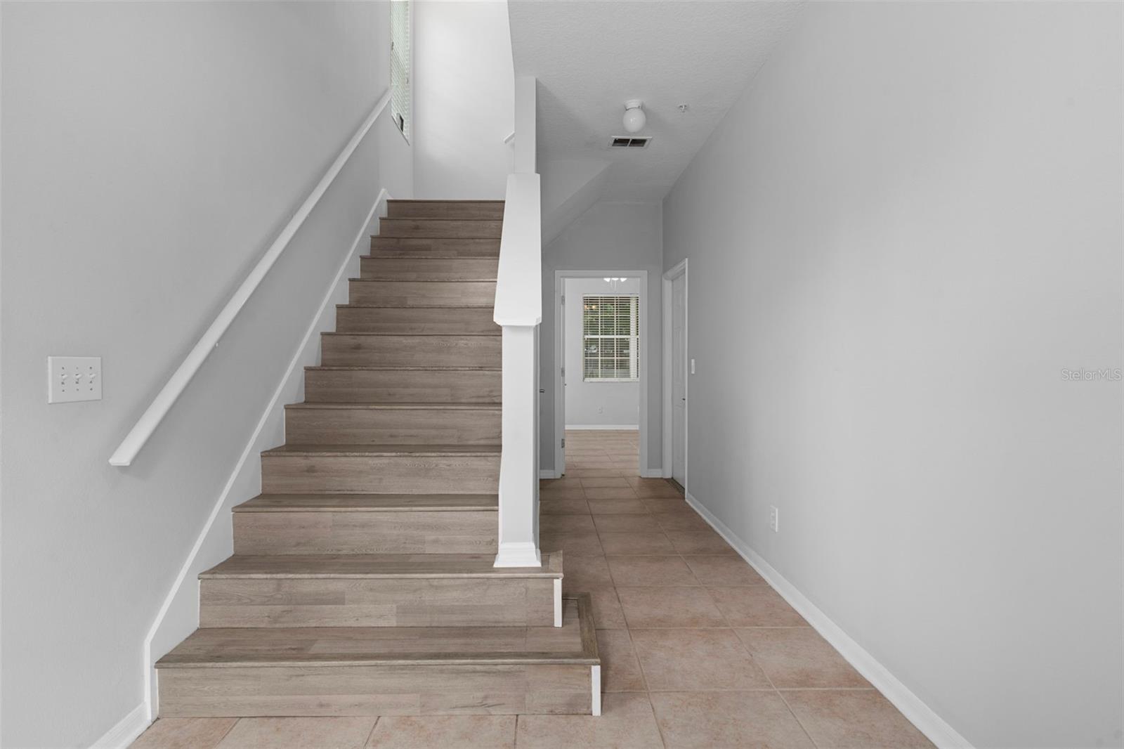 This is the view from the front door. There is gorgeous tile flooring throughout the first floor.