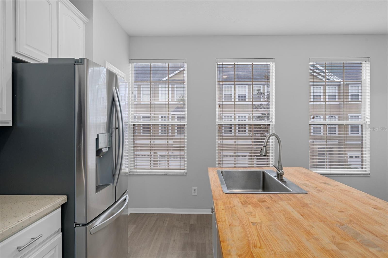Lots of windows make the kitchen and dining area light and bright