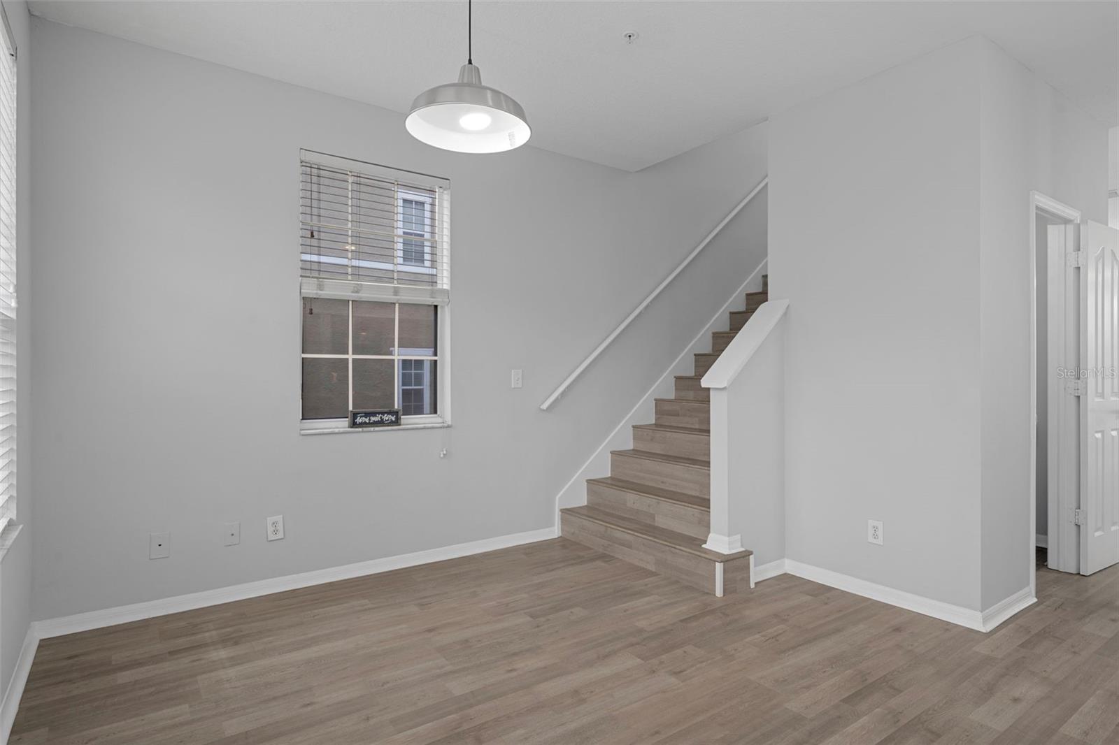 Stairs from the dining area lead up to third floor