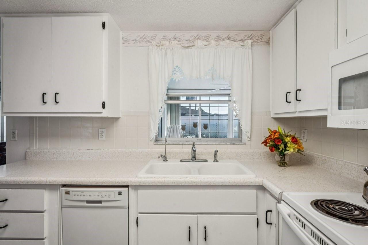 Kitchen has a pass through window