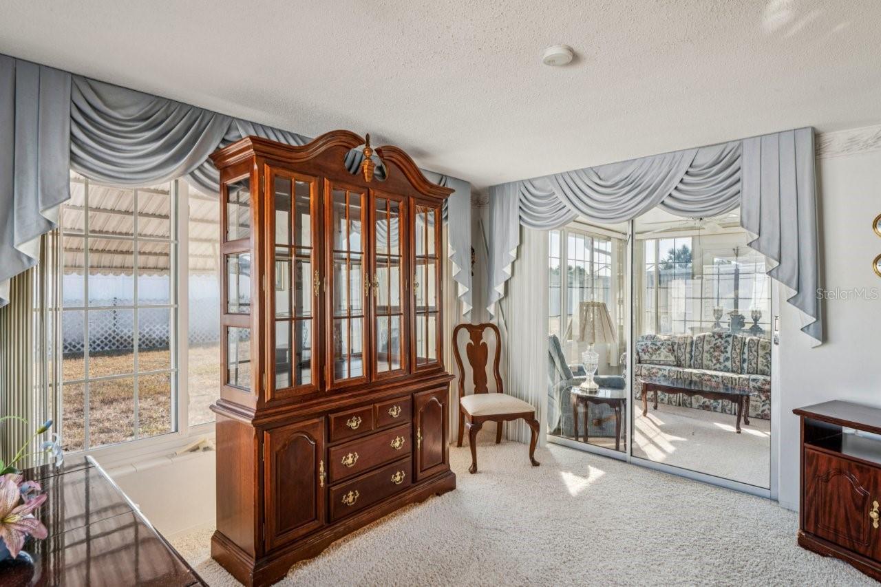 Family room has slider onto the sunroom