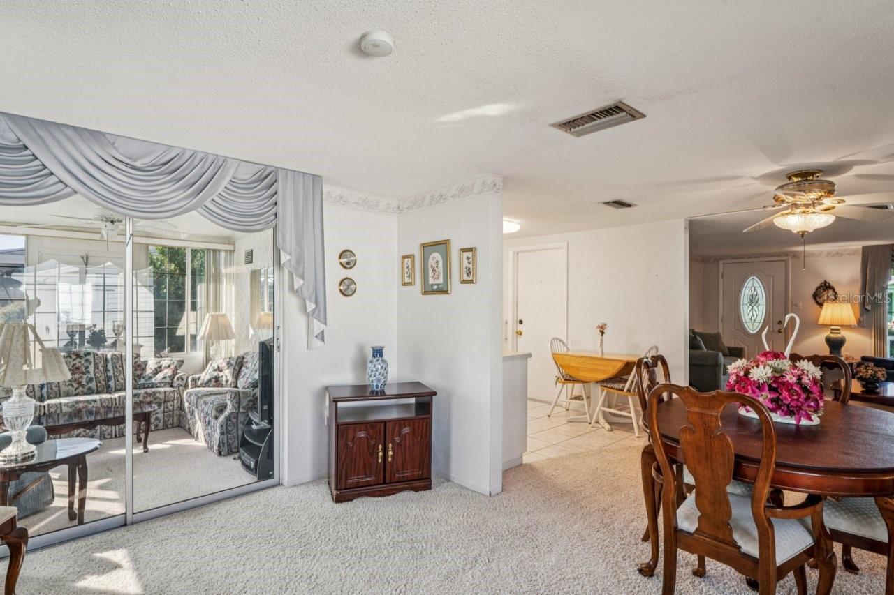 Interior view of the dining area and the sunroom.