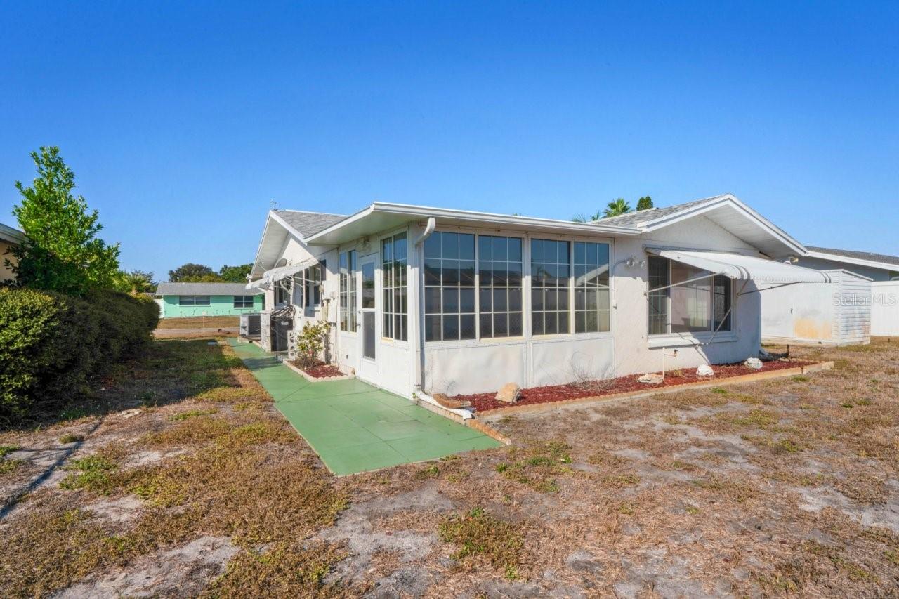 Back yard and the back of the house view.