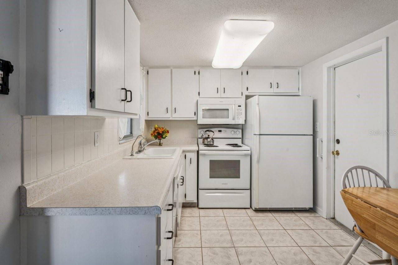 Kitchen has entrance to the garage