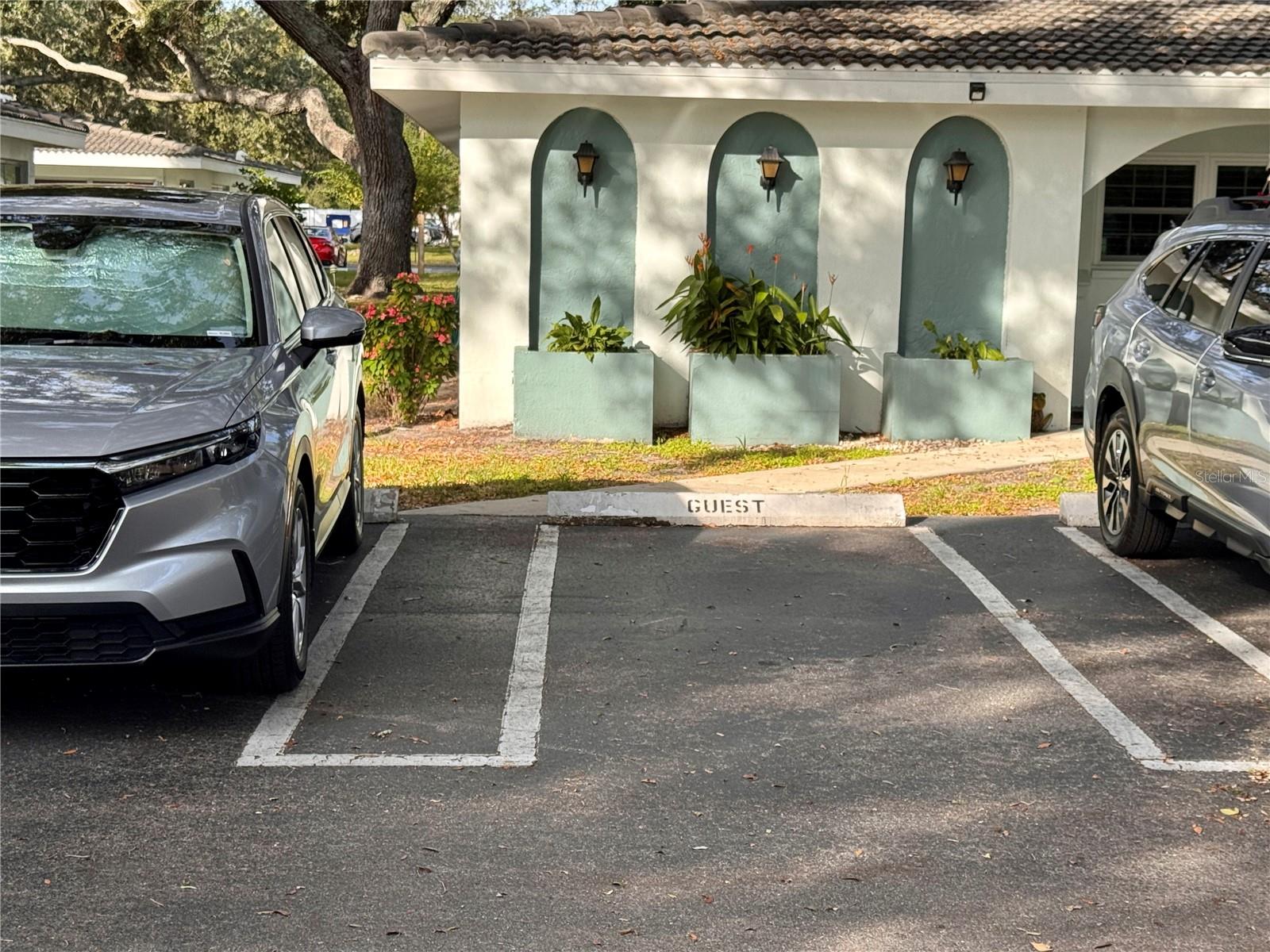 Unit 123's designated parking spot on the left, guest on the right!