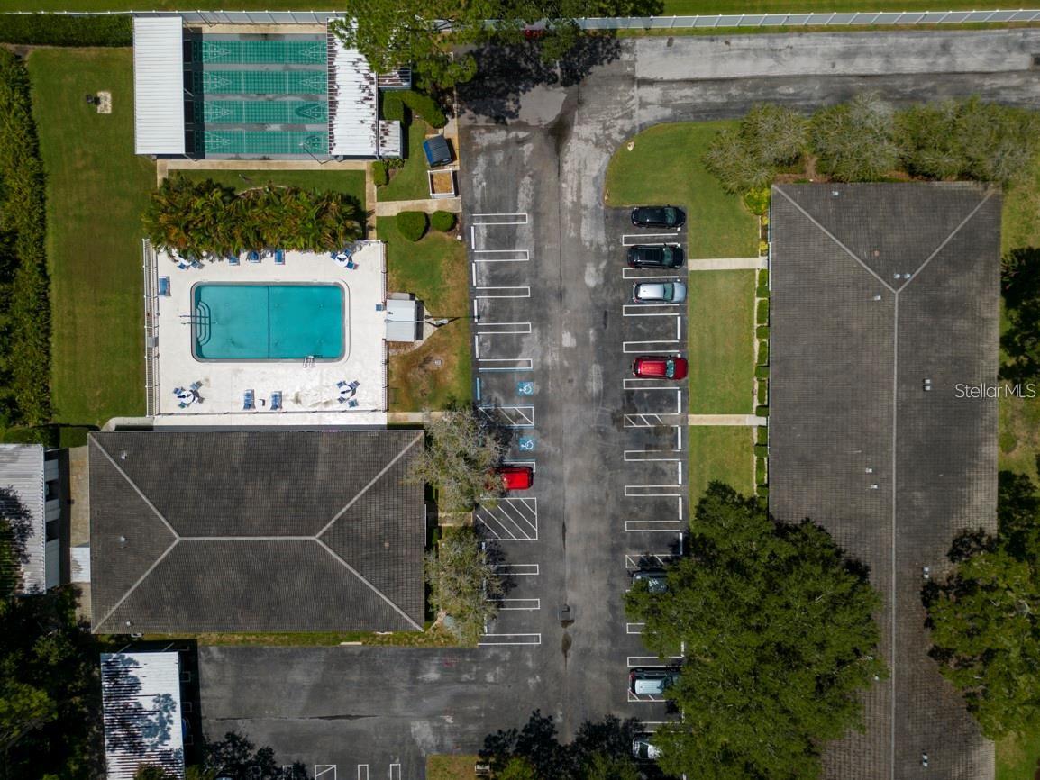 A closer look at the Clubhouse, pool, and shuffleboard courts. notice plenty of available parking for visitors