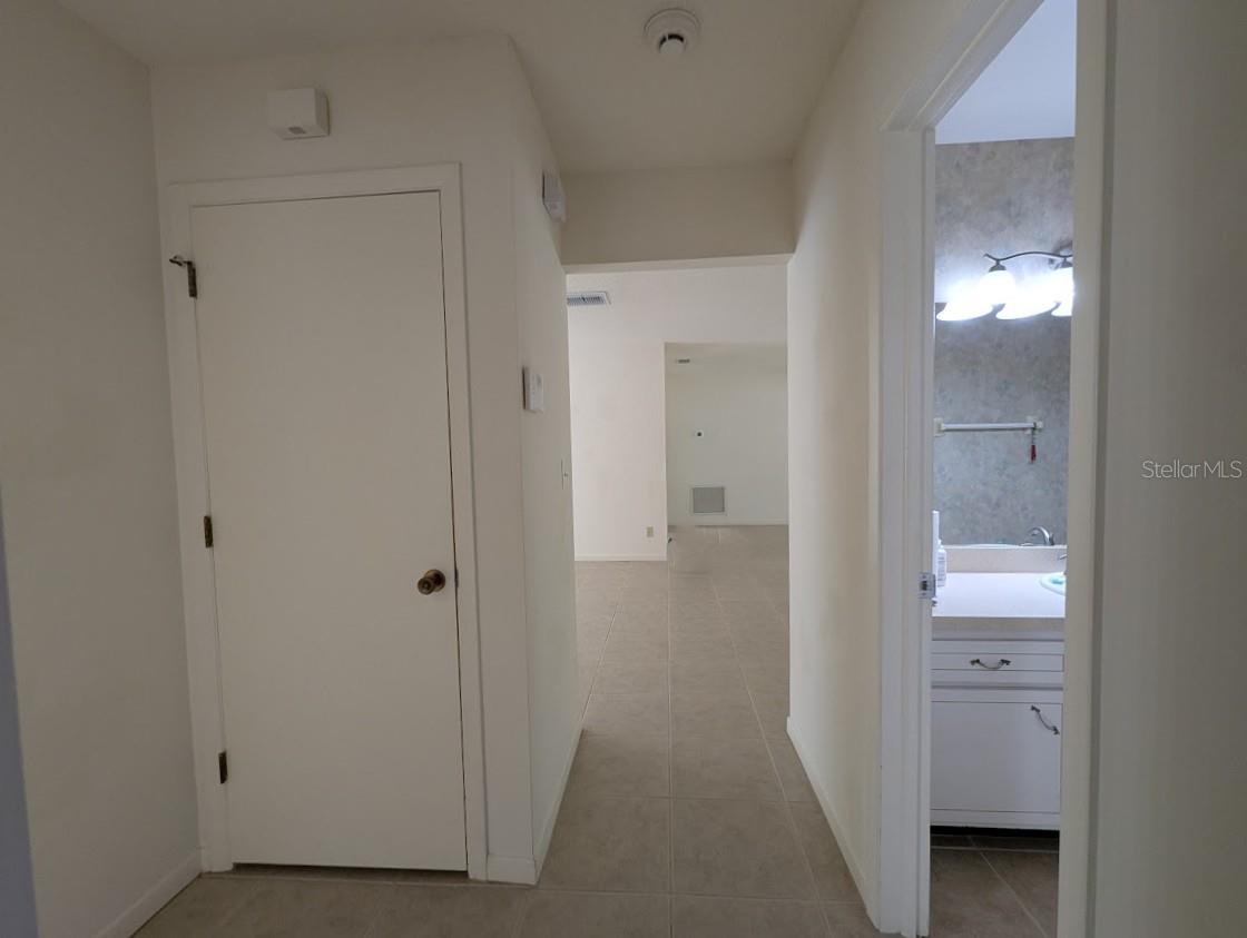 Hallway with coat closet