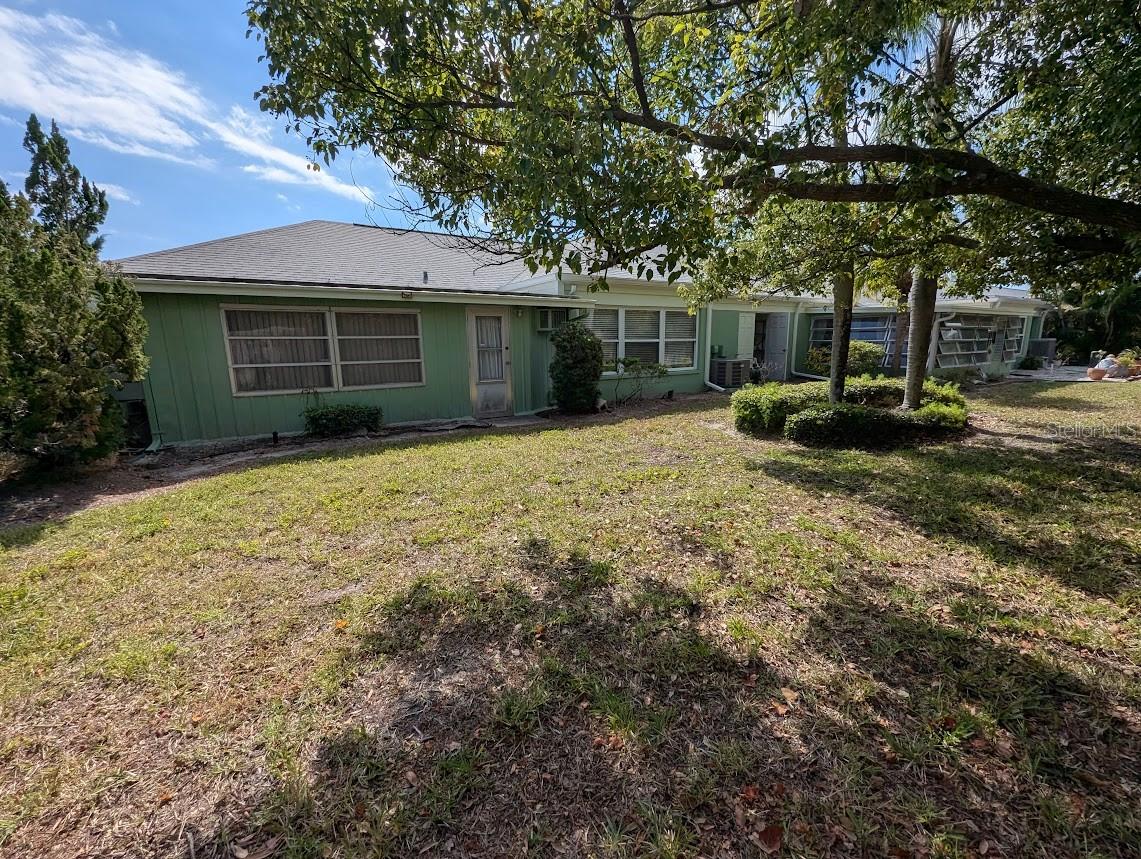 Rear of property with entry to Florida room