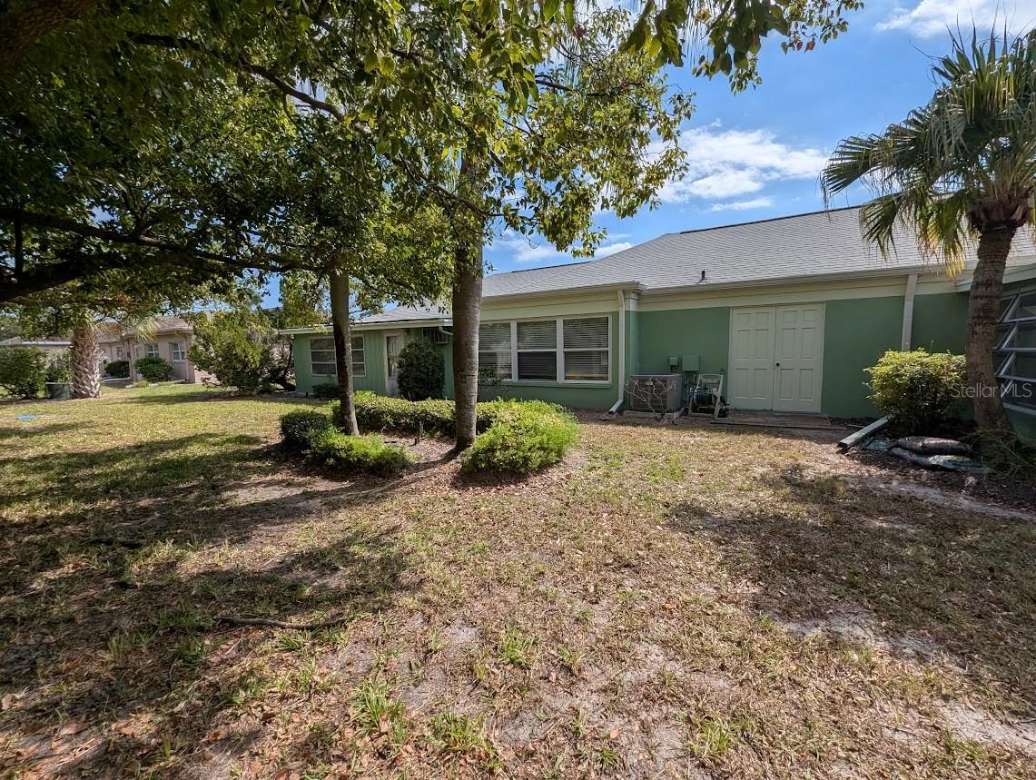Rear of property with double doors from garage