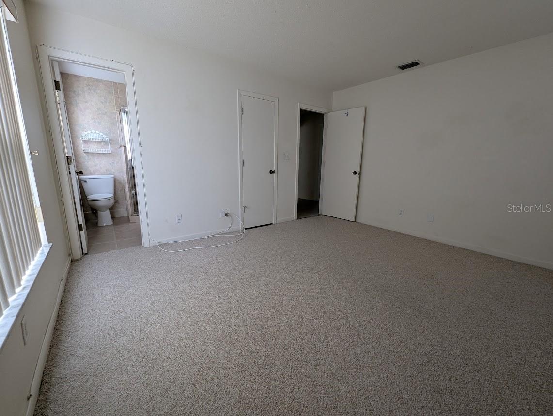 Primary bedroom, en suite bath and walk in closet