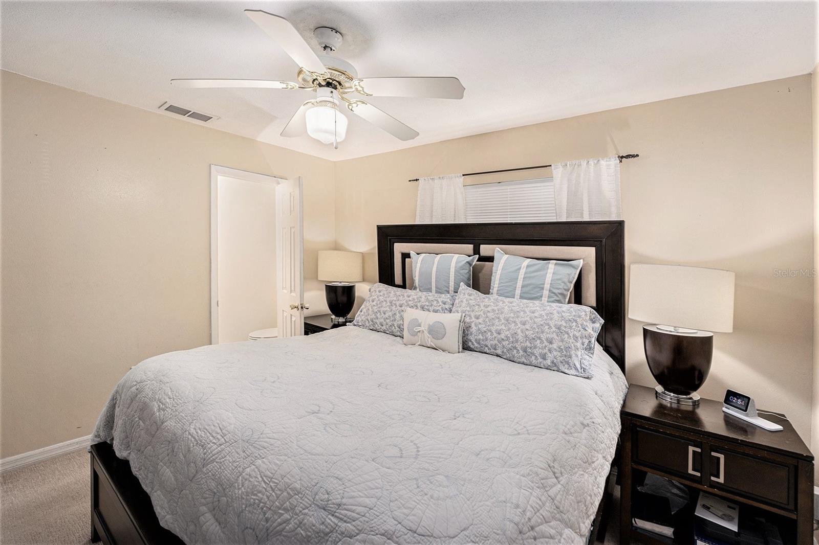 Primary bedroom with a 1/2 bath ensuite.