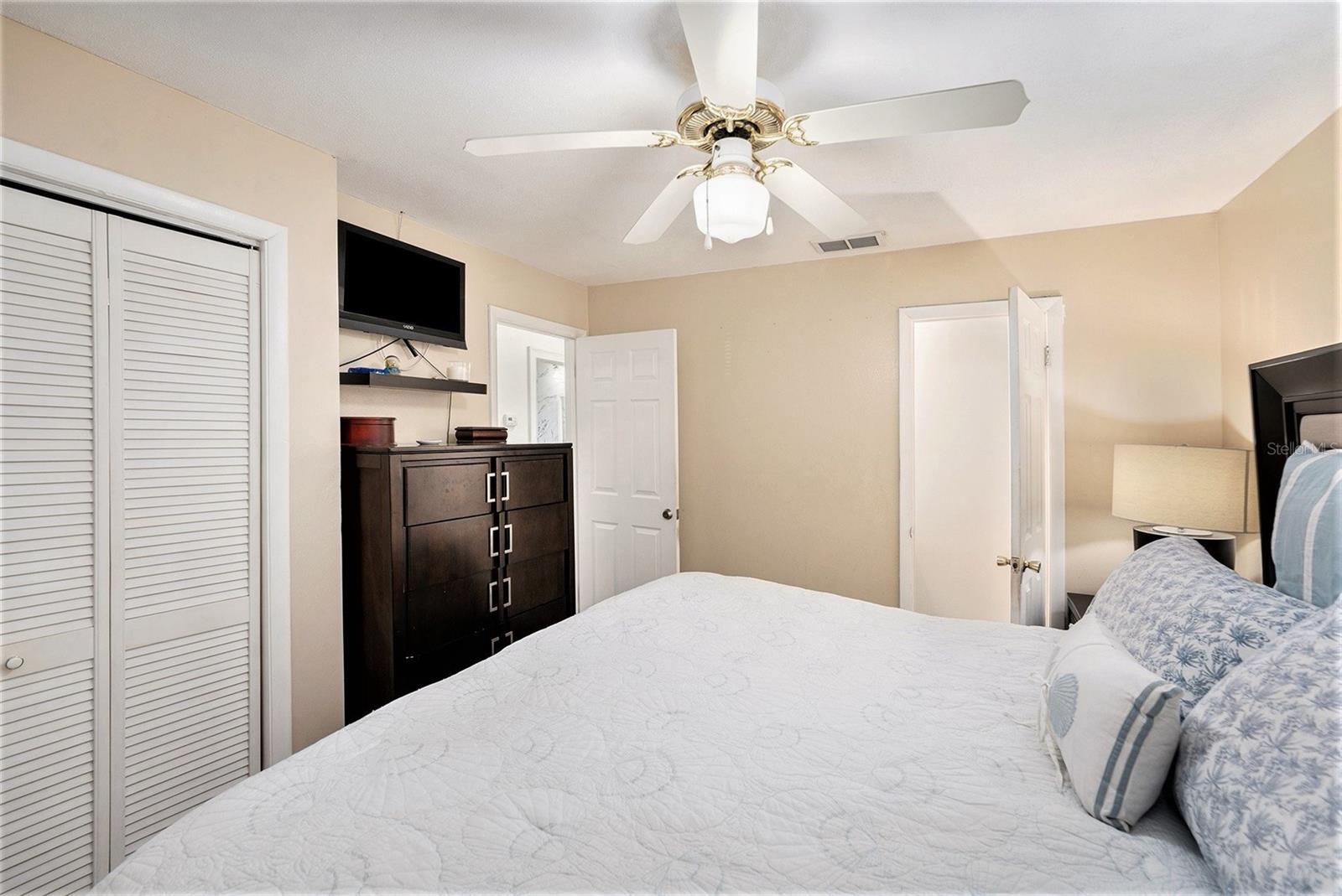 Primary bedroom with a 1/2 bath ensuite.