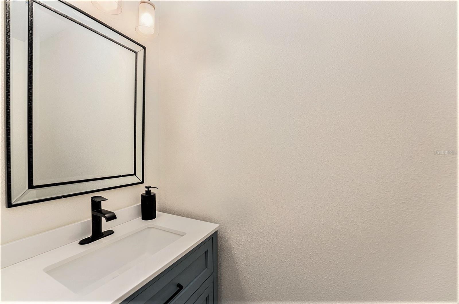 Half bath ensuite - primary bedroom.