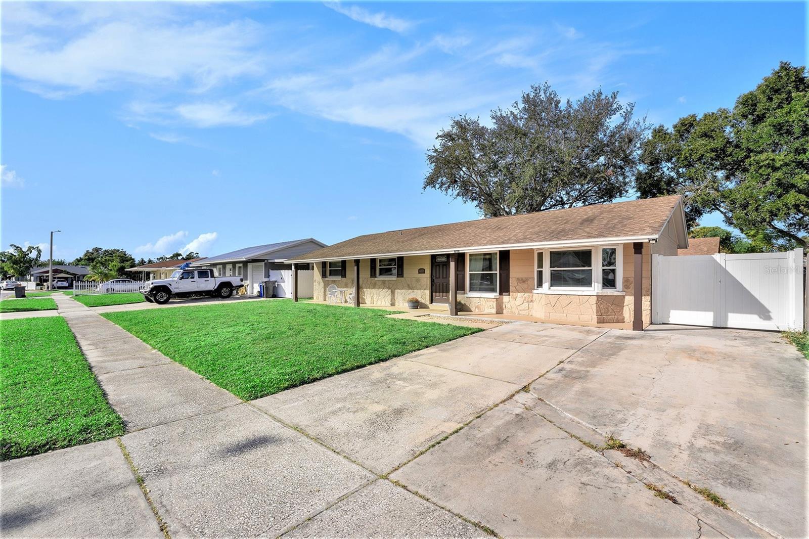 Wide driveway can easily accommodate multiple cars.