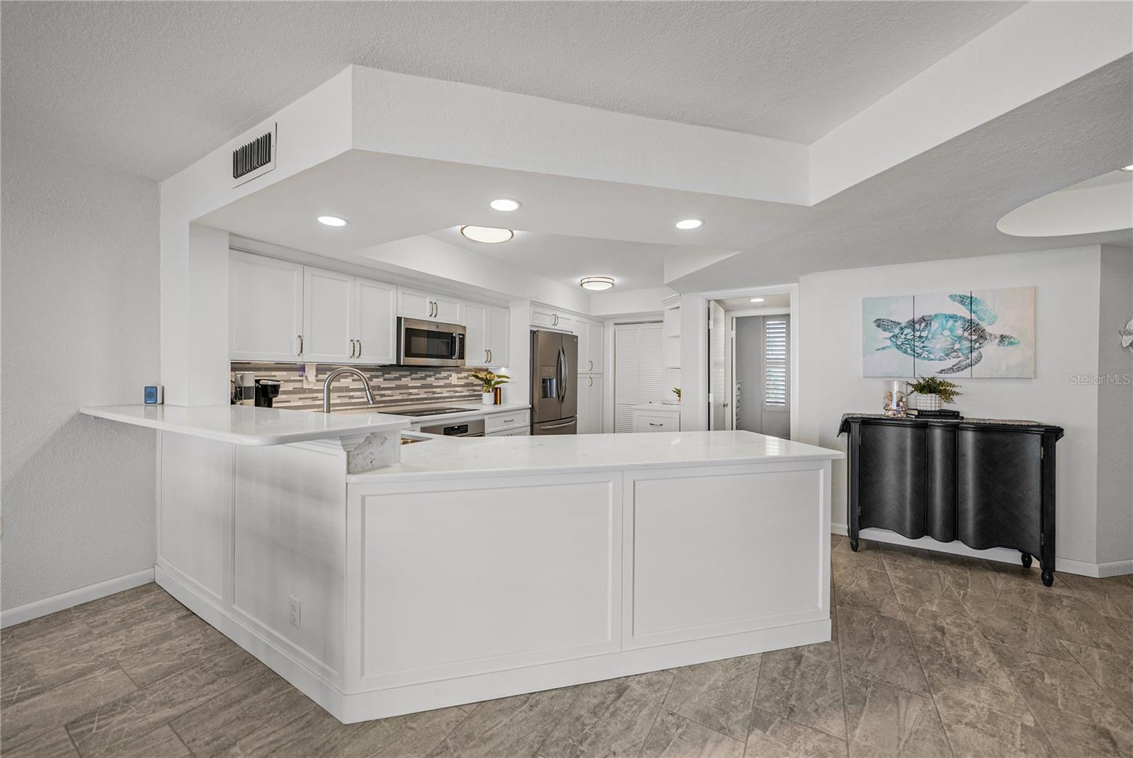 Gourmet Kitchen with countertop bar seating for 3