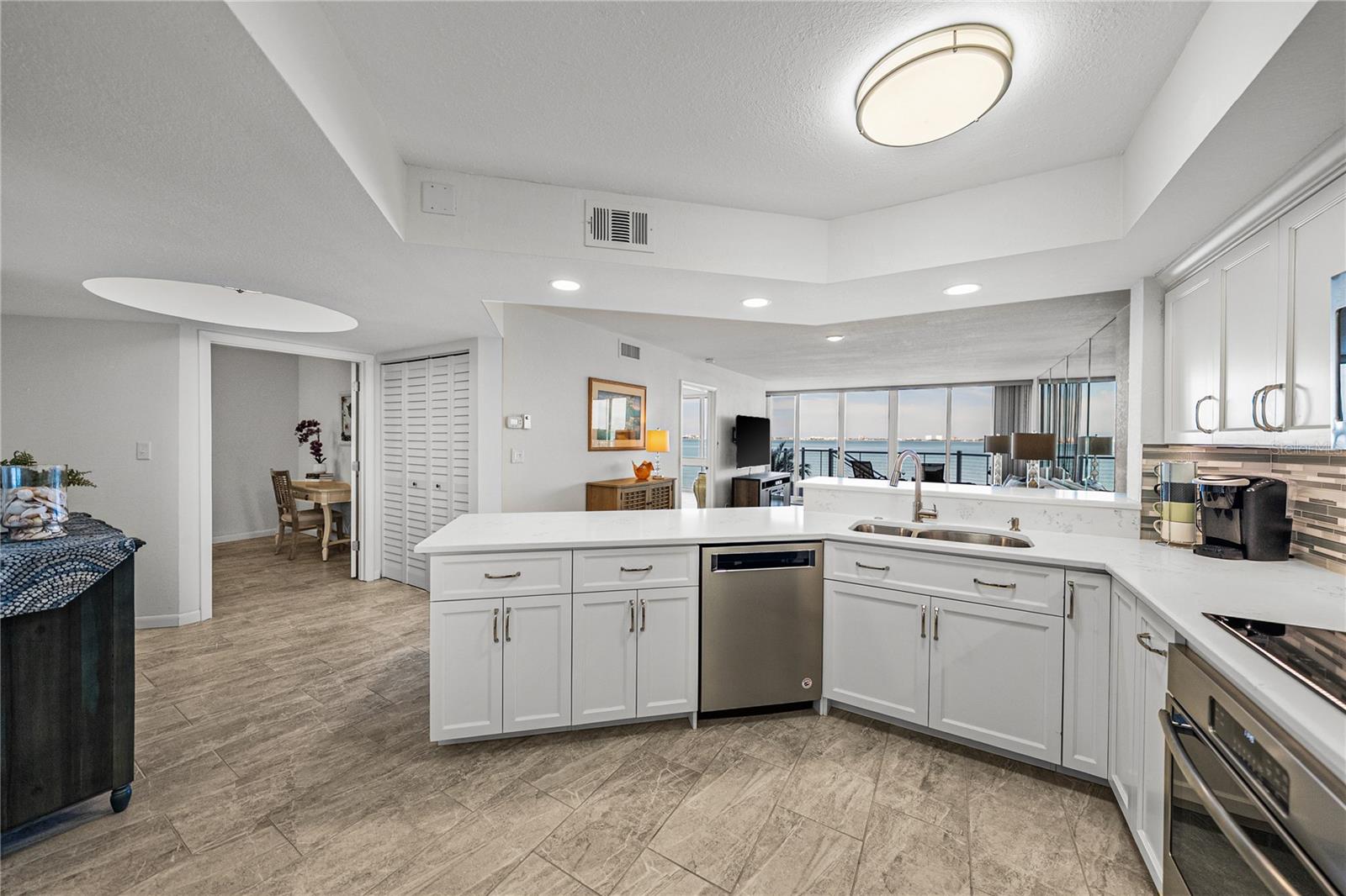 Gourmet Kitchen with view of study and primary bedroom suite